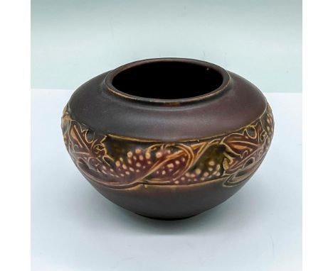 Small vase decorated in a brown semi-matte finished and adorned in an Art Nouveau style grape pattern. R stamped on the under