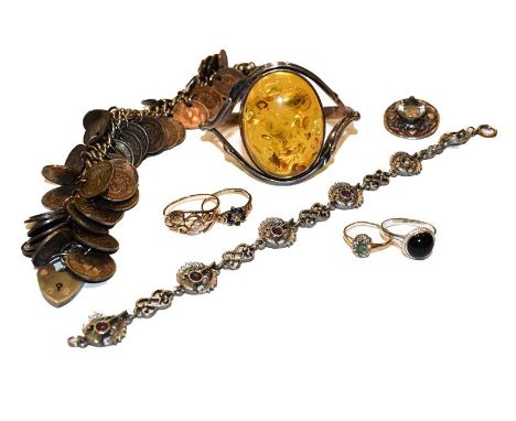 A collection of jewellery including an amber bangle, two 9 carat gold cluster rings (a.f.), two further rings, a coin bracele