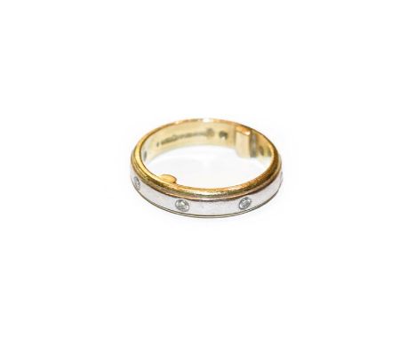 An 18 carat gold diamond set band ring, finger size F1/2 (approximately, sizing beads to inner shank).  Gross weight 5.0 gram