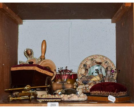 Two Victorian mahogany pin cushions including one of sarcophagus form, a brass sewing clamp and others, two pin cushions ador