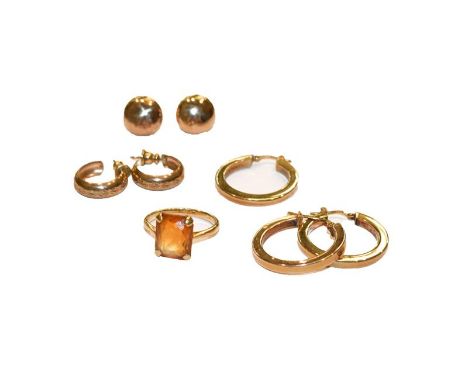 A citrine ring, finger size M; three pairs of 9 carat gold earrings; and a 9 carat gold odd earring.  Ring - stamped but mark