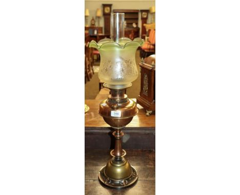 An Art Nouveau brass based oil lamp with etched glass shade, 72cm overall
