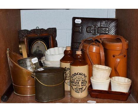 A Victorian leather bound photograph album, two pairs of leather cased binoculars, brass and copper measures, a 19th century 