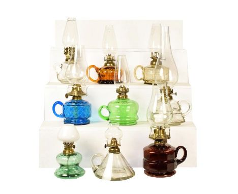 A Victorian brass based oil lamp with associated Vaseline glass shade, a Mary Gregory style glass oil lamp and a tray of asso