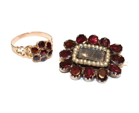 A garnet and split pearl mourning brooch, measures 2.8cm by 2.3cm; and a garnet cluster ring, finger size P.  Gross weight 6.