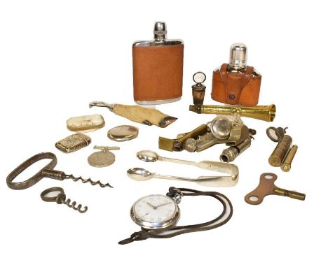A tray of assorted items including silver vesta case and sugar tongs, 19th century corkscrews, brass hunting horn, two leathe