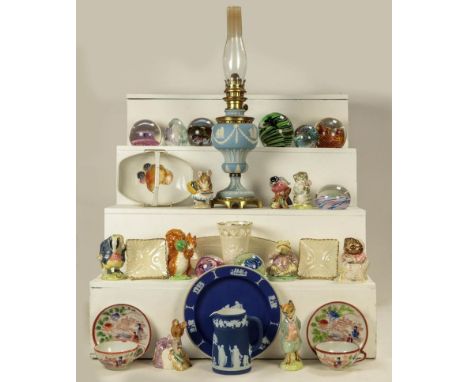 A 19th century pale blue Jasperware oil lamp, a quantity of various paperweights by Caithness and Strathearn together with a 