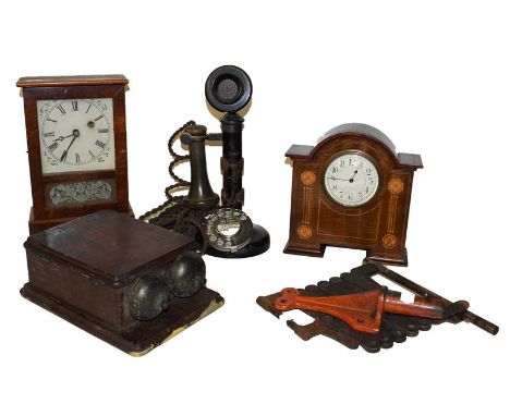 A vintage stick telephone and GPO bells, an Edwardian inlaid mantle timepiece and a Ansonia timepiece etc (two trays)