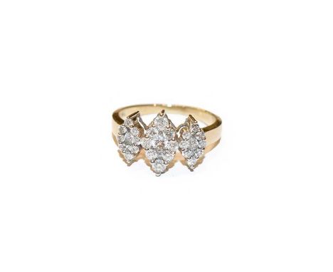 A diamond triple cluster ring, the graduated kite shaped clusters set throughout with round brilliant cut diamonds, in white 