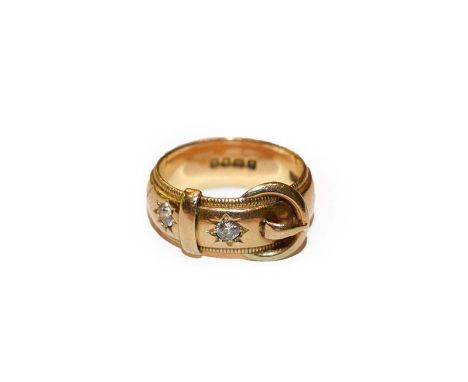 An 18 carat gold diamond buckle ring, finger size S1/2.  Gross weight 13.1 grams. 