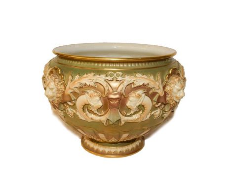 Royal Worcester jardiniere moulded with lion masks and scroll work on a gilt ground with printed puce mark, 26cm wide 