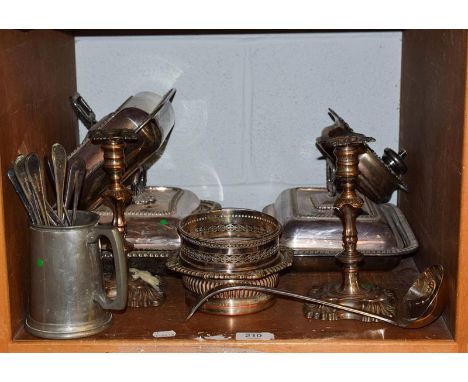 A quantity of silver plate including three entree dishes, a pair of candlesticks and wine coasters etc (one shelf)