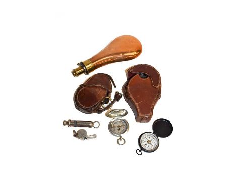 Two leather cased WWI compasses, two other small compasses, shot powder flask, and two whistles stamped ARP and AM23/230