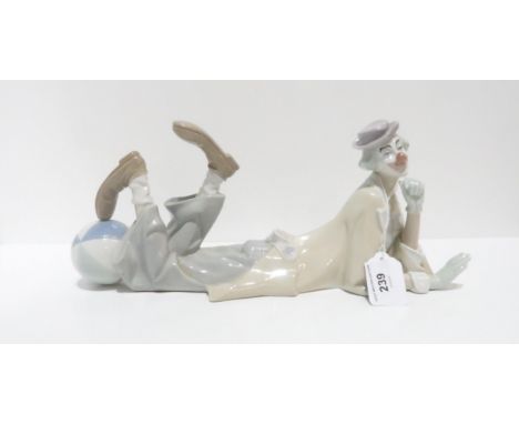 A Lladro Clown figure 4618 Condition Report:There appears to be a sealant or some glaze that has been put on a section of the
