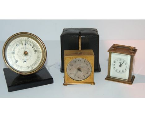 A miniature travel alarm clock in fitted case, 5cm wide (af), a miniature carriage clock and a desk top barometer (3) Conditi