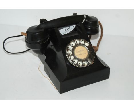 A vintage black Bakelite telephone Condition Report:Available upon request