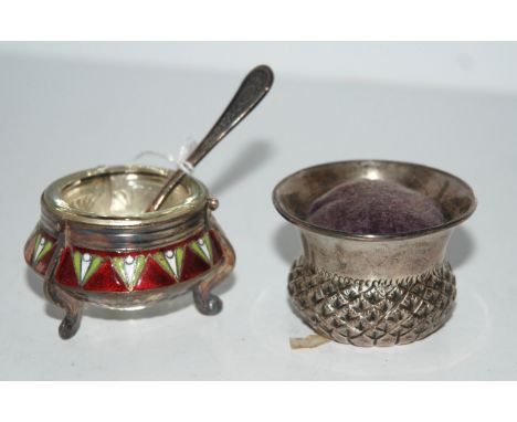 A novelty silver pin cushion, a thistle head and a gilt-metal and enamel salt Condition Report:Available upon request
