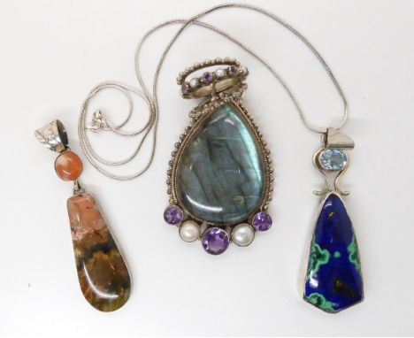 A large labradorite pearl and amethyst silver pendant, an American silver agate pendant, signed RM, and a further aquamarine 