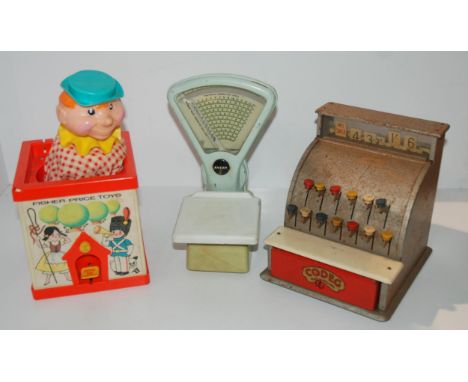 A Fisher Price jack-in-the-box, child's scales and till Condition Report:Available upon request