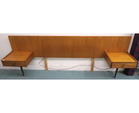 A mid 20th century teak G Plan headboard with flanking single drawer bedside table, 84cm high x 244cm wide x 43cm deep Condit