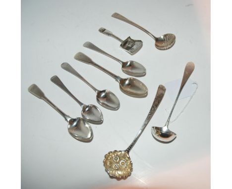 A Georgian silver sifter ladle, 13cm long, a silver caddy spoon, Birmingham 1814, two silver sauce ladles and five teaspoons,