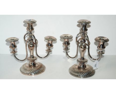 A pair of silver-plated three-light candelabra, 27.5cm high Condition Report:Available upon request