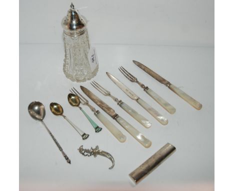 A silver-topped glass sugar caster, Chester 1921, two pars silver mother of pearl knives and forks, Birmingham 1910, an EP an