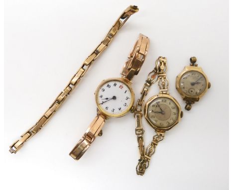 A 9ct gold ladies vintage watch, two 9ct gold watch heads, and a 9ct strap, weight holding the gold plated strap away, but in