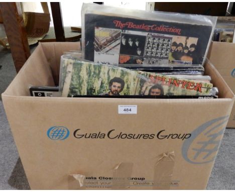 A box of vinyl LP records with The Merseybeats, The Concert for Bangladesh, Tommy by The Who, Splinter, The Lovin' Spoonful, 
