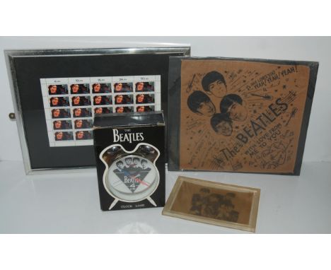 A Beatles alarm clock in original box, Beatles handkerchief, stamps etc Condition Report:Available upon request