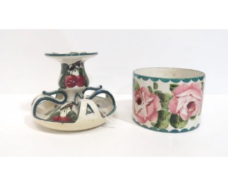 A Wemyss cherry pattern candlestick, impressed and stamped mark, and a Wemyss cabbage rose pot, painted and impressed mark Co