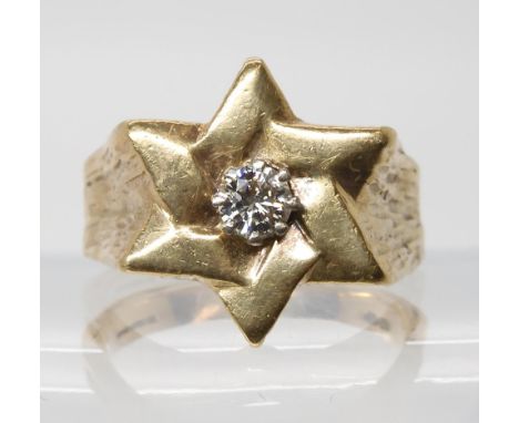 A Star shaped gents ring set with an estimated approx 0.40ct brilliant cut diamond, finger size Y1/2, weight 15gms Condition 