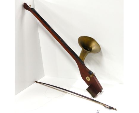 A phonofiddle by A. T. Howson, London. Made of wood with curved brass horn with a flared bell attached to amplify sound, one 