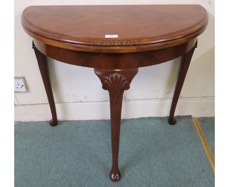 A 20th century mahogany demi lune fold over card table on cabriole supports, 73cm high x 81cm wide x 41cm deep Condition Repo