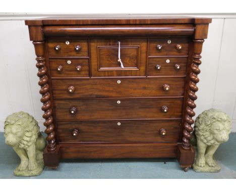 A Victorian mahogany "Scotch" chest of drawers with four above three drawers flanked by barley twist columns, a further two f