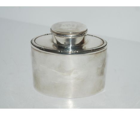 A silver tea caddy, Birmingham 1919 of oval form, 9.5cm high, 131 grams Condition Report:Available upon request