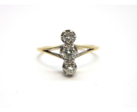 A THREE STONE DIAMOND RING the brilliant cuts, totalling approximately 0.22cts, set along the finger, finger size M