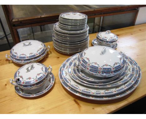 A SOHO POTTERY EXTENSIVE DINNER SERVICE comprising twelve breakfast plates, twelve dinner plates, six graduated serving platt