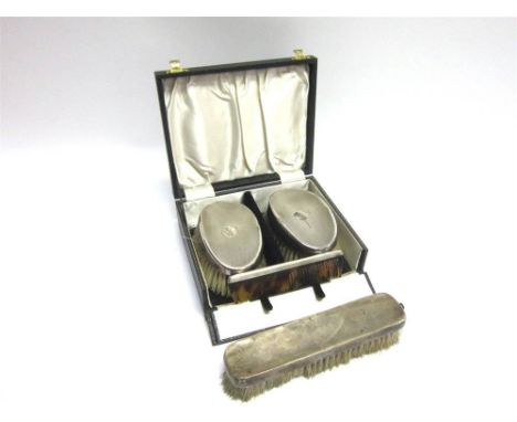 A CASED PAIR OF SILVER BACKED BRUSHES with a comb having a silver spine; and a single silver backed brush