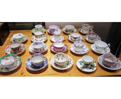 A COLLECTION OF NINETEEN 19TH CENTURY TEACUPS AND SAUCERS with hand painted and transfer print patterns