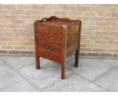 A GEORGIAN MAHOGANY TRAY TOP COMMODE with cupboard above a pull out commode below, 48cm wide