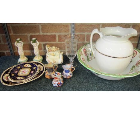 A MIXED GROUP OF GLASS AND CERAMICS to including jugs, teapot, plates, washbowl, a pair of porcelain candlesticks in the form