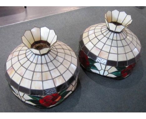 A PAIR OF TIFFANY STYLE HANGING LIGHT SHADES with floral decoration, 55cm diameter