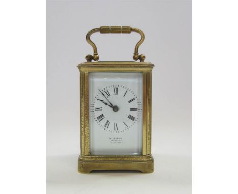A MINIATURE CARRIAGE CLOCK the enamel dial with Roman numerals and inscribed 'Cattermou, Importer, Oxford Street' the brass c