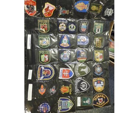 FOLDER OF 120 POLICE FORCE CLOTH PATCH BADGES WORLD 