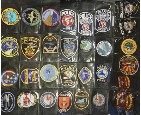FOLDER OF 60 POLICE FORCE CLOTH PATCH BADGES AIR & AIRPORT 