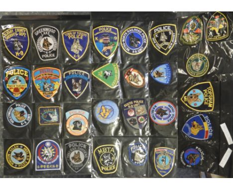 FOLDER OF 90 POLICE FORCE CLOTH PATCH BADGES K9 (DOG) HANDLERS 