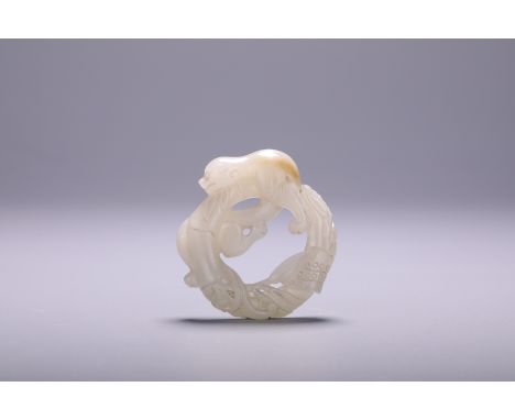 A Chinese jade 'Dragon' carving, Dia 5 cm