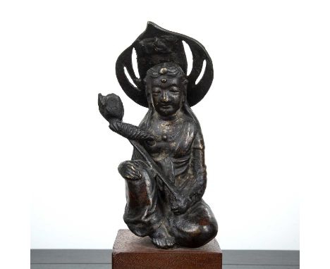 Part gilded bronze BodhisattvaSouth East Asian, 17th Centurythe kneeling figure holding a lotus flower, and with lotus flower