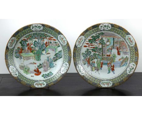 Pair of famille verte porcelain chargersChinese, late 19th Centuryeach painted with terrace scenes, with scholars and attenda